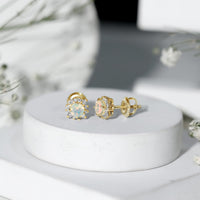Ethiopian opal stud earrings with diamond halo by Rosec Jewels, showcasing vibrant opal stones and sparkling diamond accents.