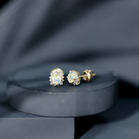 Ethiopian opal stud earrings with diamond halo from Rosec Jewels, featuring vibrant opal gemstones and sparkling diamond accents.