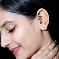 Ethiopian Opal stud earrings with diamond halo from Rosec Jewels, showcasing vibrant opal gemstones and sparkling diamond accents.