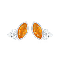 Marquise cut fire opal stud earrings with diamond trio accents by Rosec Jewels, showcasing vibrant orange gemstones and sparkling diamonds.