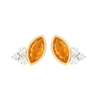 Marquise cut fire opal stud earrings with diamond trio accents by Rosec Jewels, showcasing vibrant orange gemstones and sparkling diamonds.