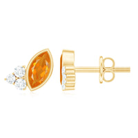 Marquise cut fire opal stud earrings with diamond trio accents by Rosec Jewels, showcasing vibrant orange gemstones and sparkling diamonds.