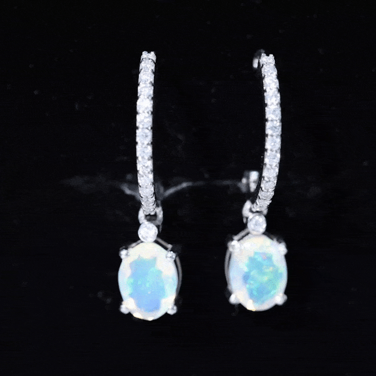 Oval rainbow opal and moissanite hinged hoop earrings by Rosec Jewels, showcasing vibrant colors and sparkling gemstones.