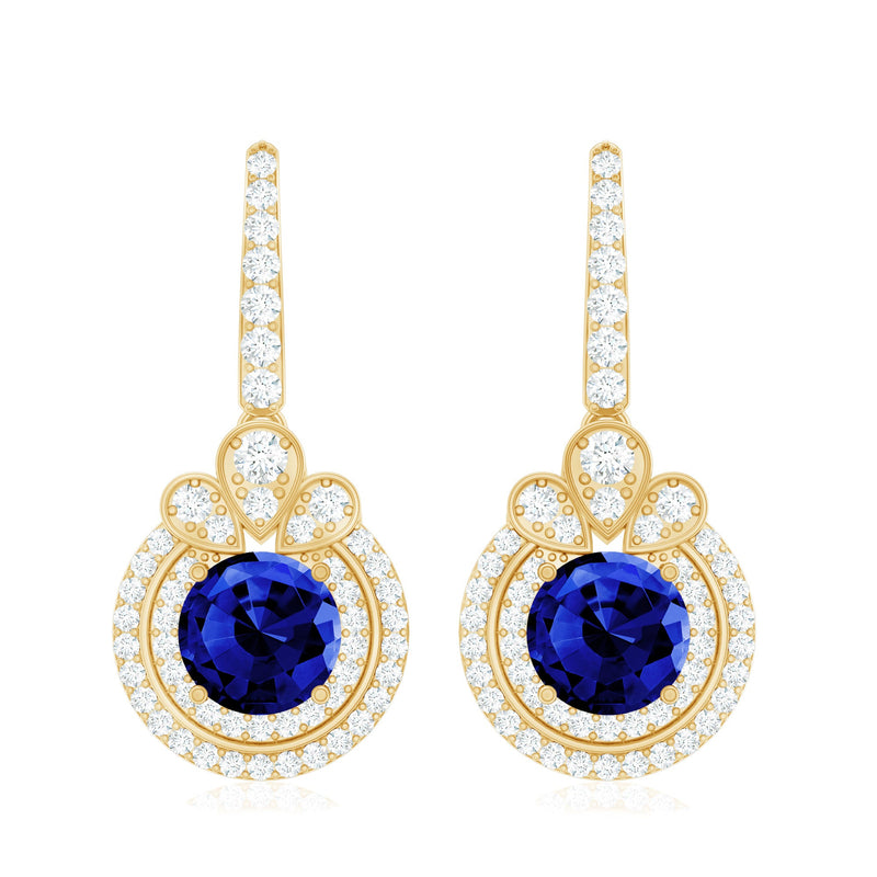 Lab-grown blue sapphire wedding earrings with diamond halo, elegant Rosec Jewels earrings featuring blue gemstones and sparkling diamonds.