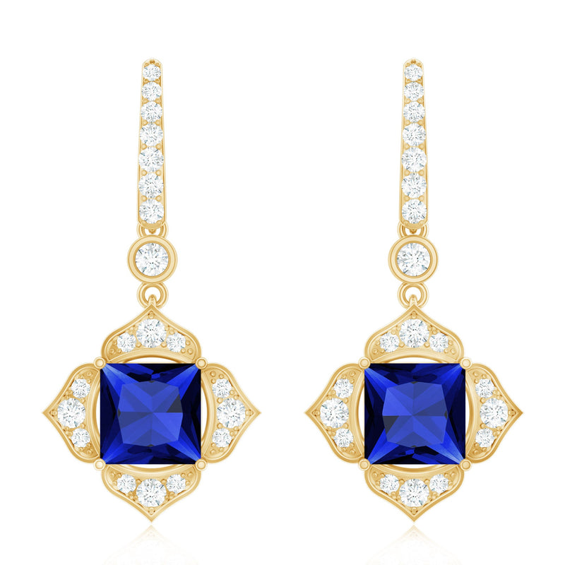 Lab-grown blue sapphire floral drop earrings with diamonds by Rosec Jewels, featuring intricate floral design and sparkling gemstone accents.