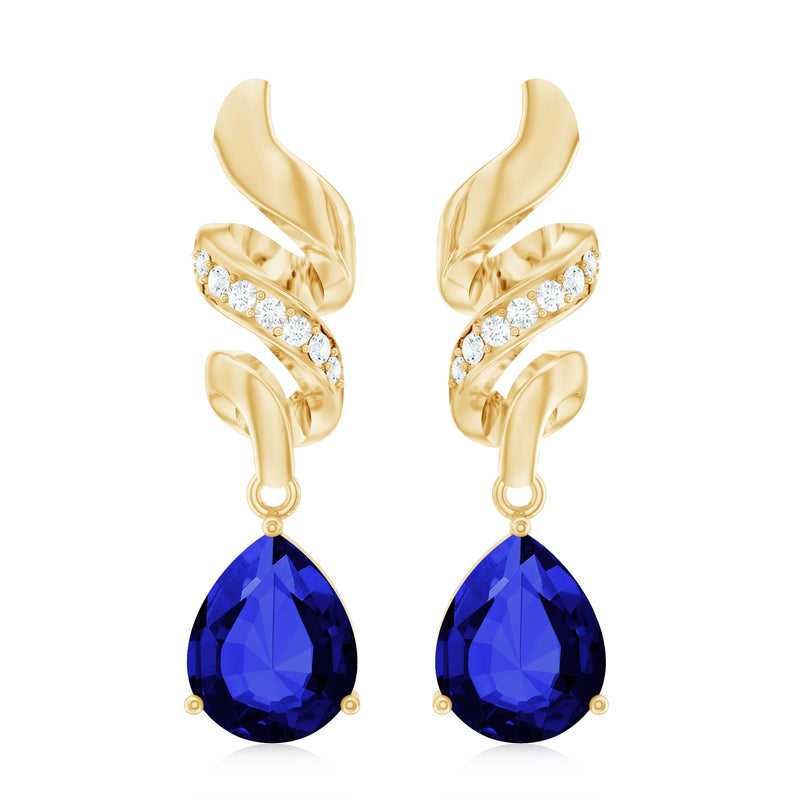 Rosec Jewels blue sapphire teardrop earrings with diamonds, showcasing elegant gemstone and intricate jewelry design.