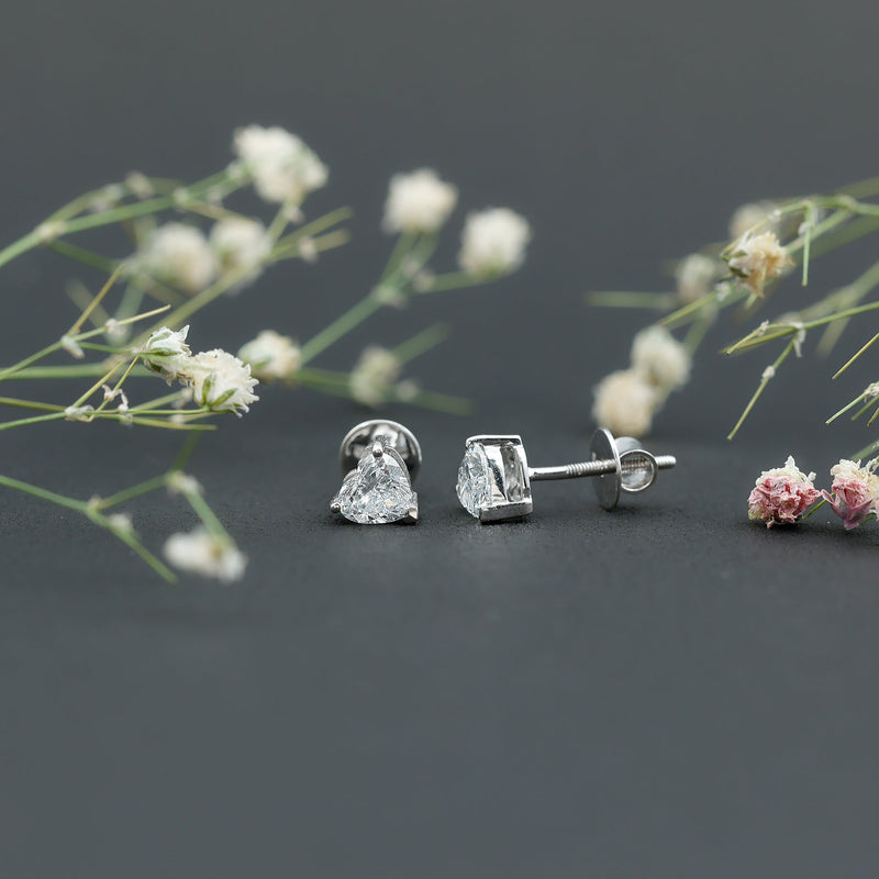 Lab grown diamond heart stud earrings in 14K gold plated silver with Rosec Jewels branding visible on the earrings.