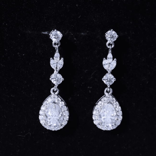 Silver teardrop dangle earrings with 2 carat cubic zirconia for weddings, by Rosec Jewels. Elegant jewelry for special occasions.