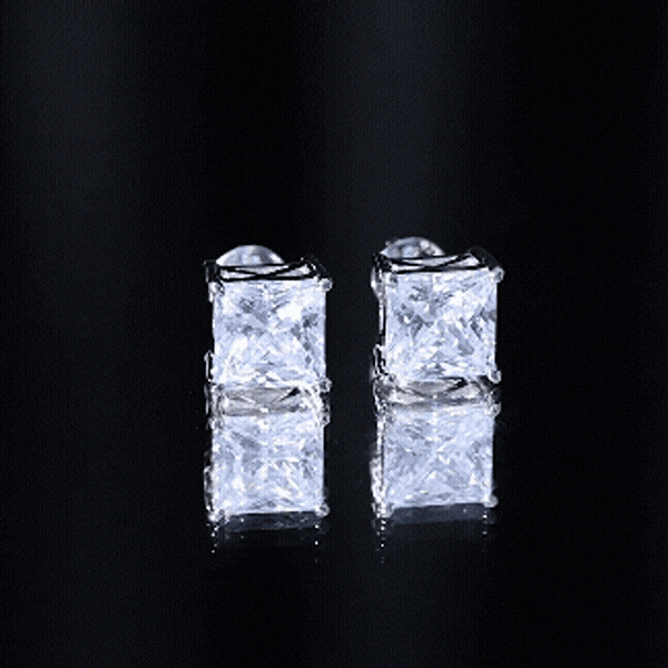 Silver cubic zirconia princess cut earrings featuring 7mm stones from Rosec Jewels, showcasing elegant jewelry design.