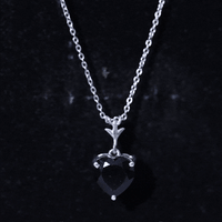 Heart-shaped black onyx solitaire pendant in 2 carats with gold chain from Rosec Jewels, showcasing elegant jewelry design.