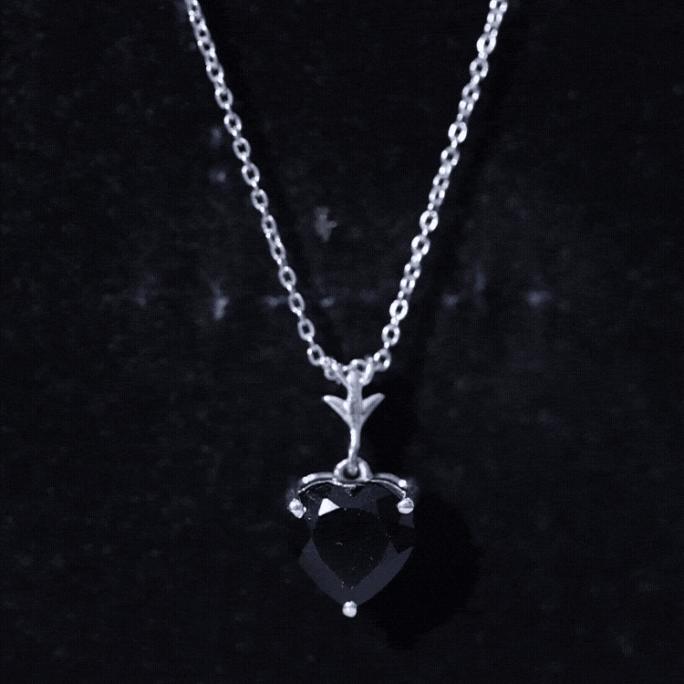 Heart-shaped black onyx solitaire pendant in 2 carats with gold chain from Rosec Jewels, showcasing elegant jewelry design.