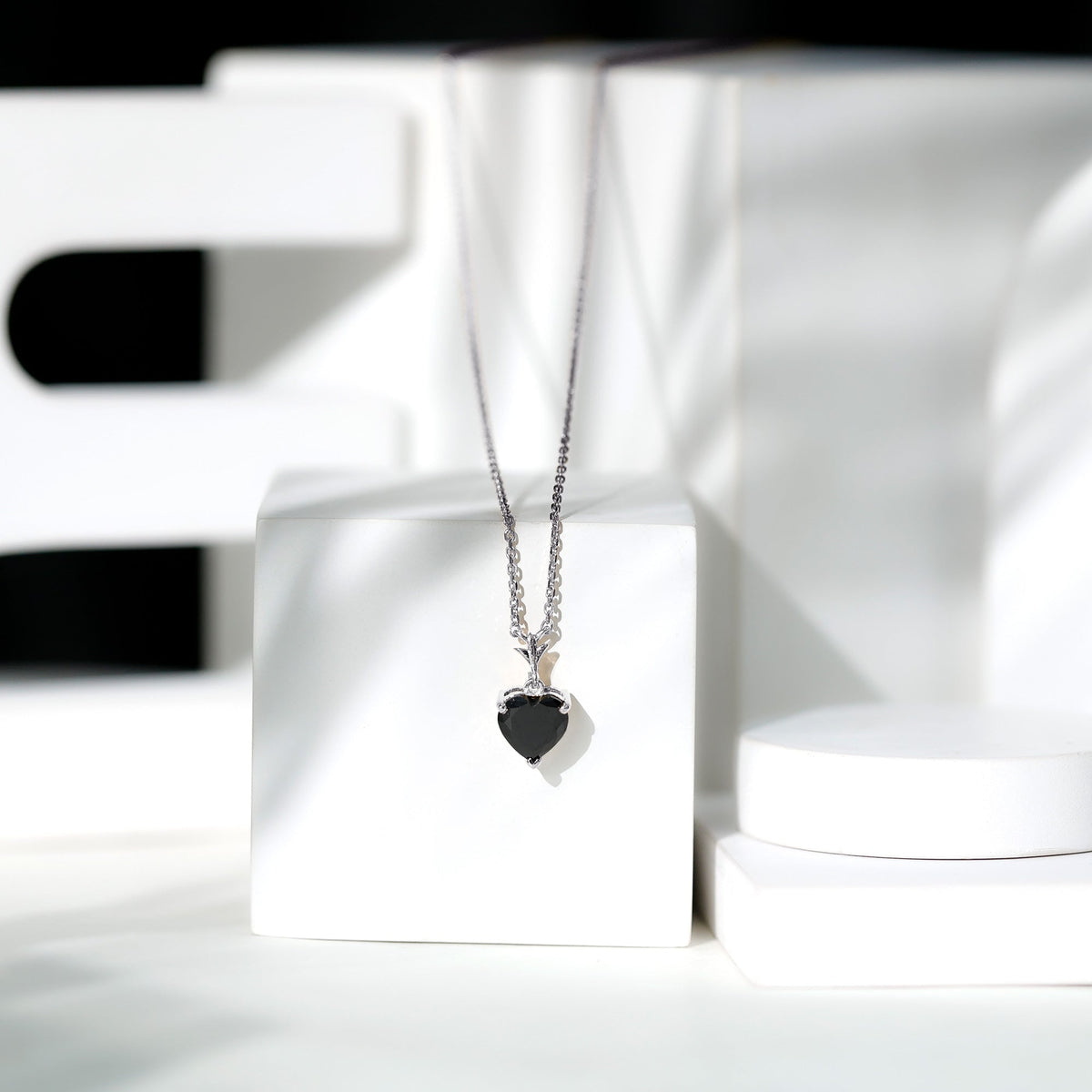Black Onyx solitaire pendant in heart shape with 2-carat weight from Rosec Jewels, featuring a sleek, polished design.