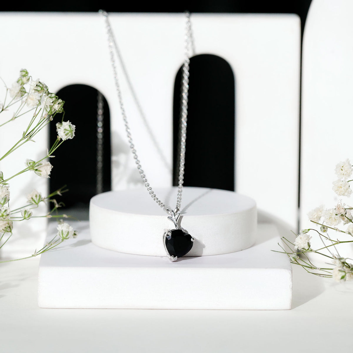 Black onyx heart-shaped solitaire pendant with a 2 carat gemstone, elegant jewelry piece by Rosec Jewels.