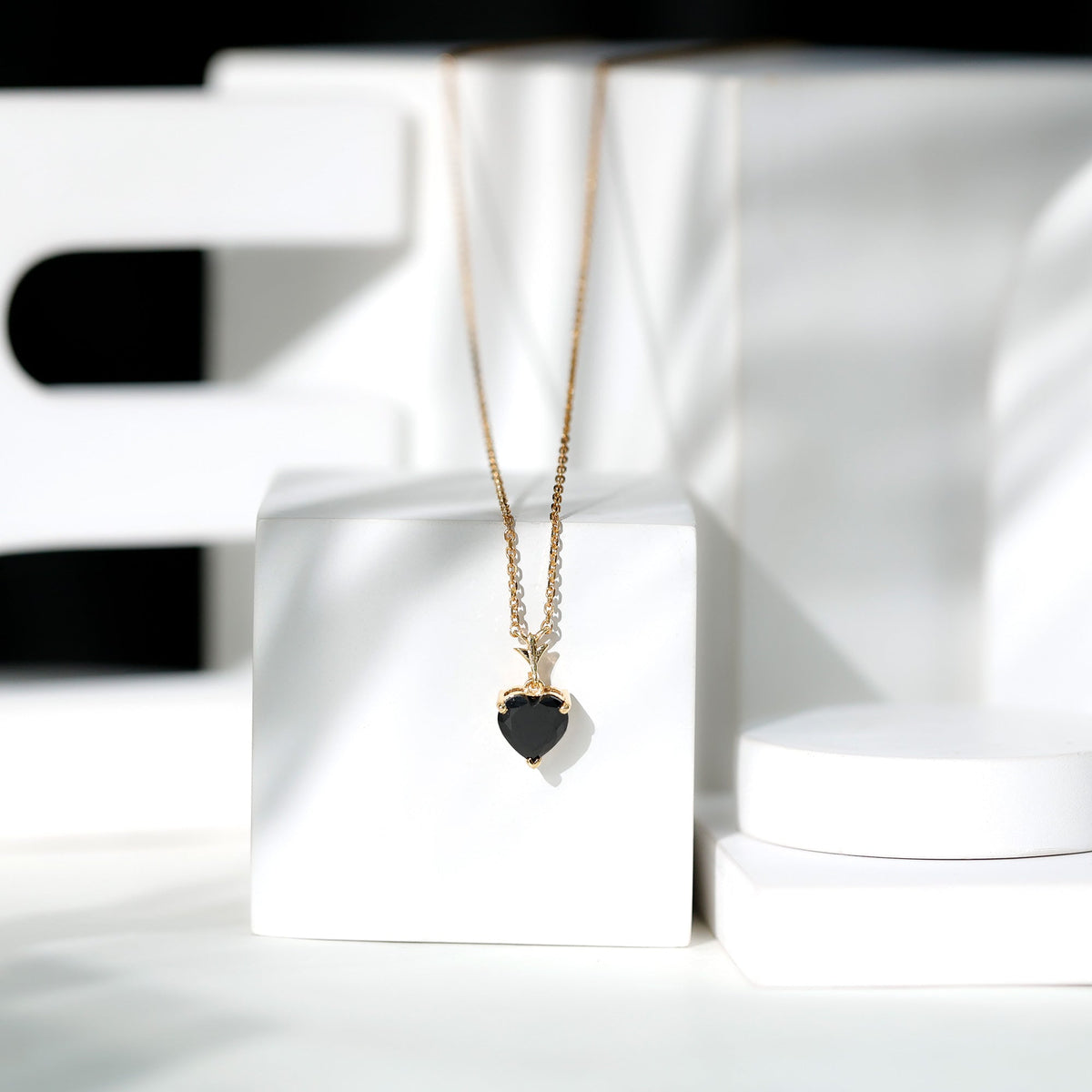 Black onyx heart-shaped solitaire pendant by Rosec Jewels featuring a 2-carat gemstone on a delicate chain.