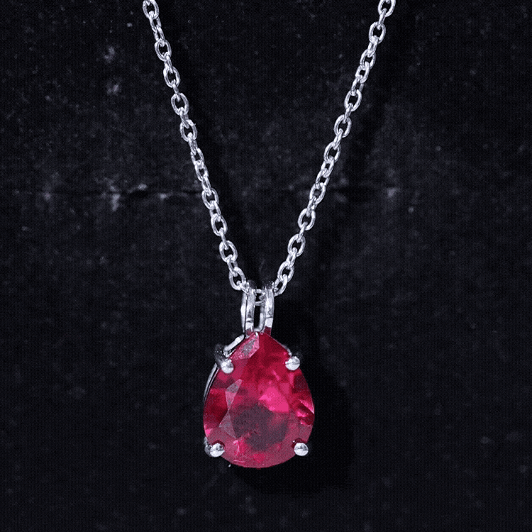 Pear-shaped lab grown ruby solitaire pendant necklace with yellow gold setting, showcasing a 3-carat ruby from Rosec Jewels.