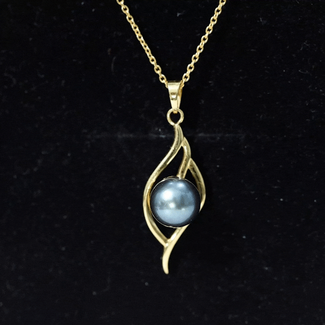 Yellow gold pendant necklace featuring an 8-carat black pearl leaf design by Rosec Jewels, showcasing a elegant jewelry piece.