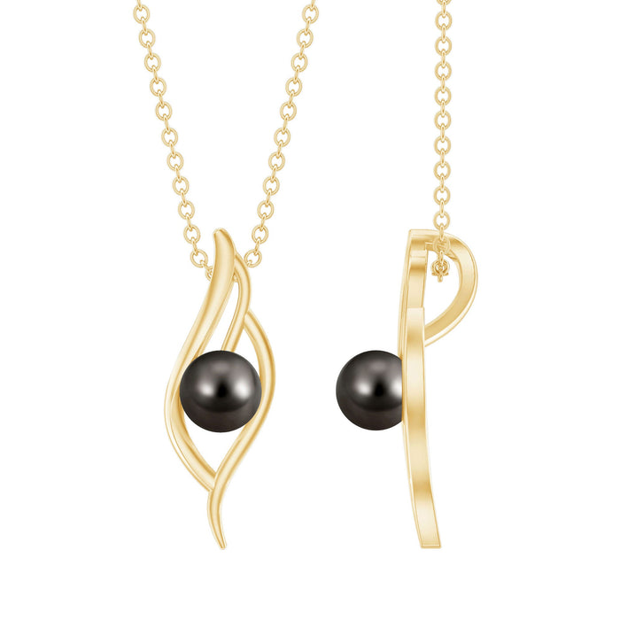 Black pearl leaf pendant necklace with 8 carat solitaire pearl from Rosec Jewels, featuring intricate leaf design.