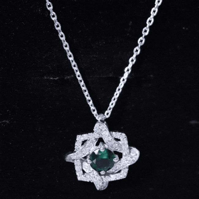 Certified 0.8 carat lab grown emerald interlock pendant on silver chain, elegant jewelry by Rosec Jewels.