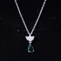 Sterling Silver 0.7 Carat Lab Grown Emerald Teardrop Necklace with Moissanite Lotus Flower