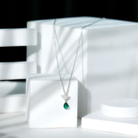 Sterling Silver 0.7 Carat Lab Grown Emerald Teardrop Necklace with Moissanite Lotus Flower