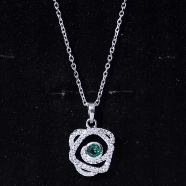 Lab grown emerald pendant necklace from Rosec Jewels featuring a vibrant white emerald in a delicate designer pendant setting.