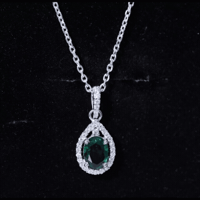 Lab-grown emerald drop pendant with moissanite, 1.26 carats, from Rosec Jewels, showcasing a sparkling jewelry pendant.