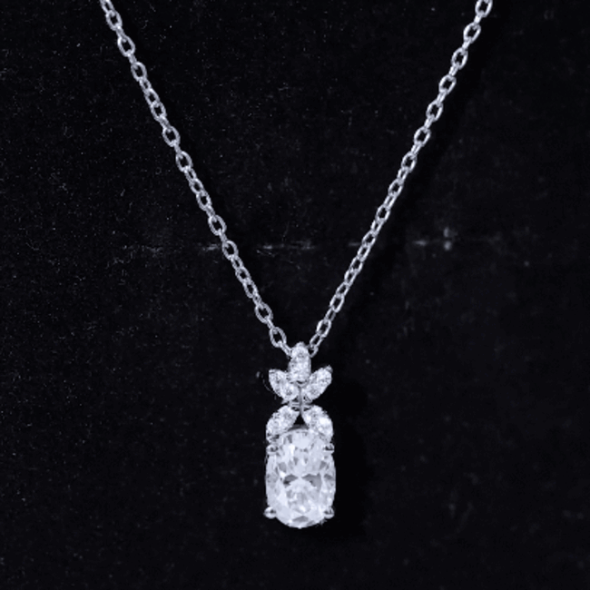 Oval-shaped lab grown diamond flower pendant with yellow accents, crafted by Rosec Jewels, showcasing intricate jewelry design.