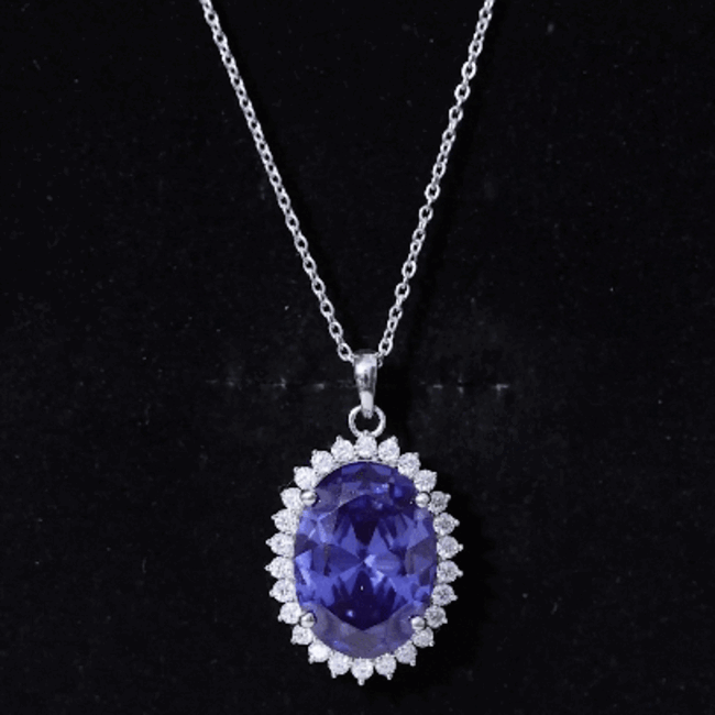 Sterling silver bridal necklace featuring a 14 carat lab-grown blue sapphire pendant from Rosec Jewels.
