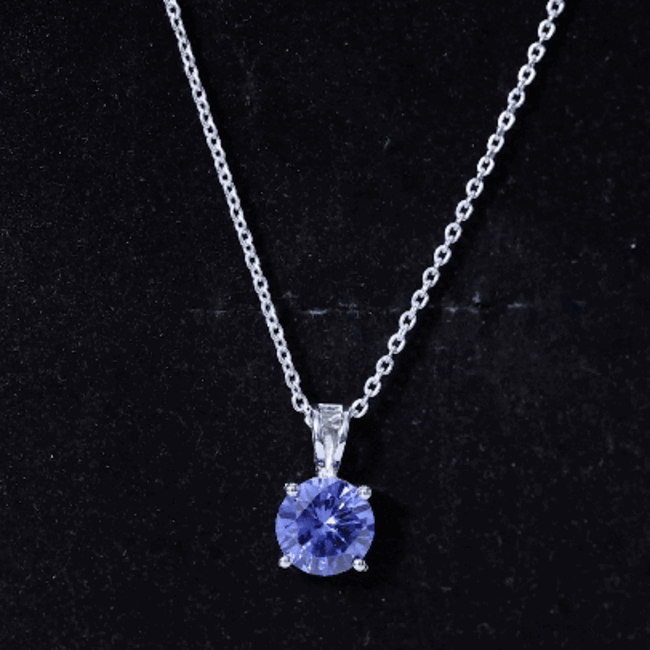 Lab blue sapphire solitaire pendant necklace with 2.7 carats on a silver chain, by Rosec Jewels, showcasing the pendant's elegant design.