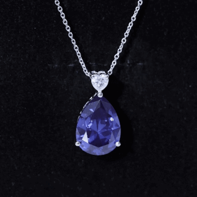 Pear-shaped lab-grown blue sapphire pendant on a silver chain, featuring a 9-carat certified gemstone from Rosec Jewels.