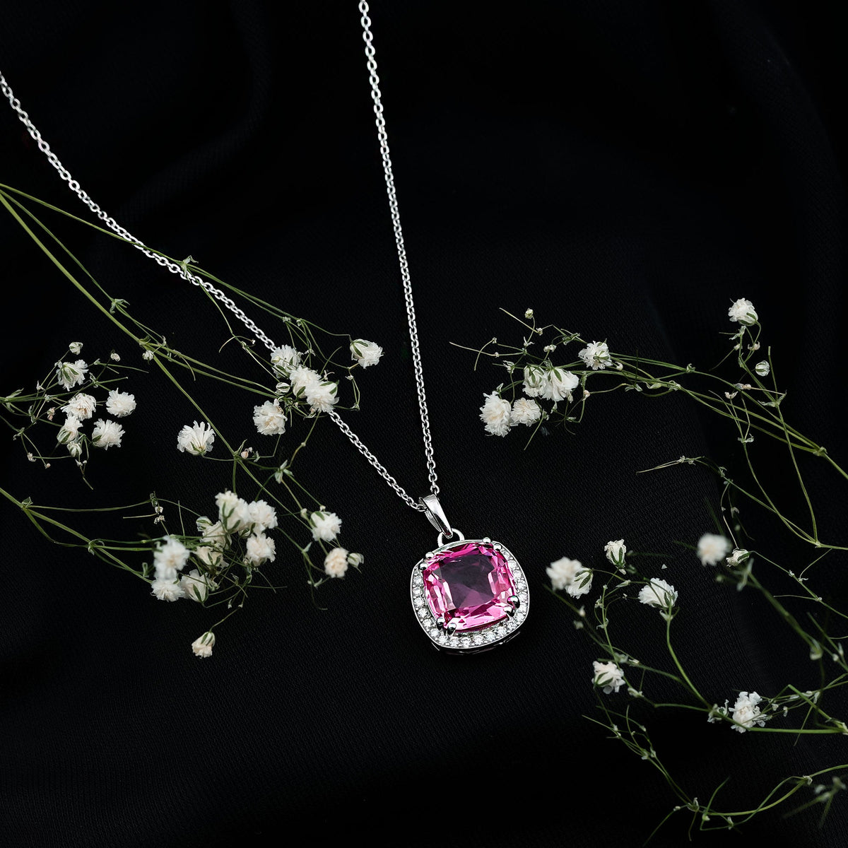Lab grown pink sapphire cocktail pendant with 6 carats on a silver chain, featuring a sparkling pink gemstone and elegant design.