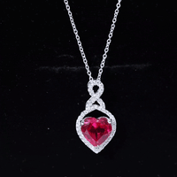 Yellow lab-created ruby heart infinity pendant with chain by Rosec Jewels, showcasing a sparkling ruby heart charm on a delicate chain.