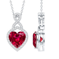 Lab-created ruby heart infinity pendant with chain by Rosec Jewels, showcasing a sparkling red gemstone and elegant design.