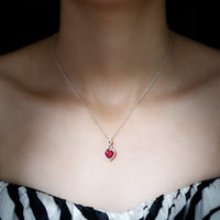 Lab-created ruby heart infinity pendant with chain from Rosec Jewels, showcasing a sparkling red gemstone and elegant design.