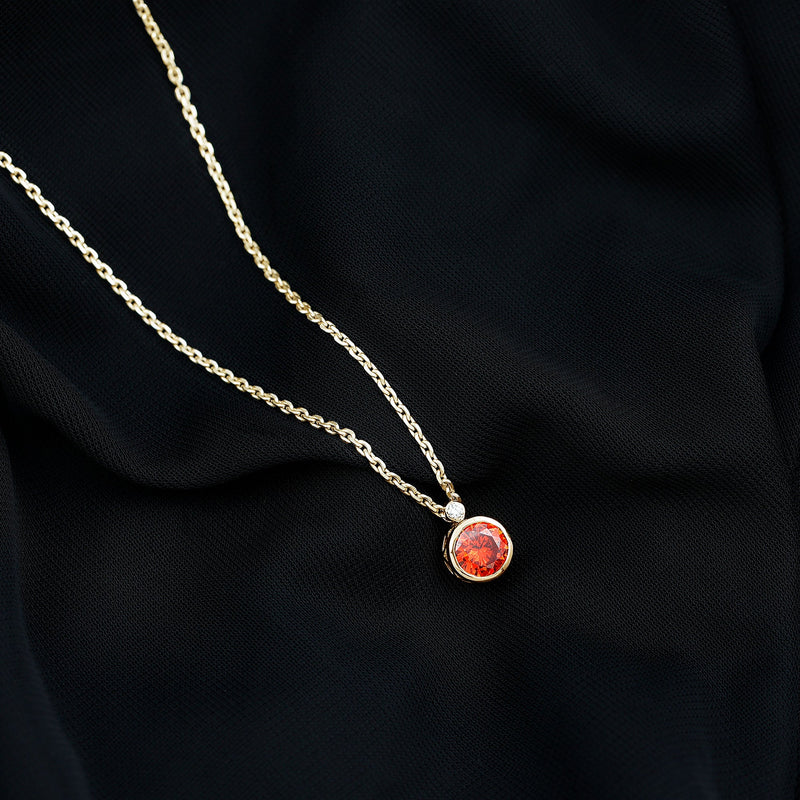 Bezel-set 2.25 carat lab-grown orange sapphire pendant necklace by Rosec Jewels, showcasing a vibrant orange gemstone.