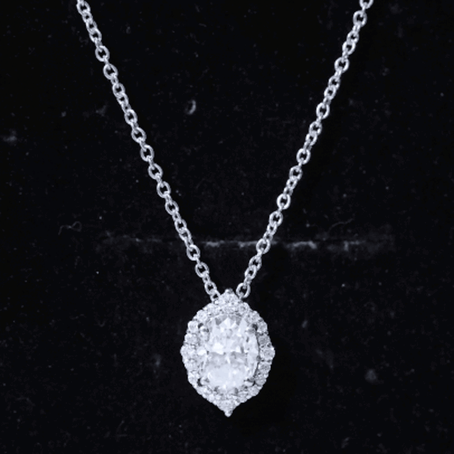 Oval-shaped lab-grown diamond wedding pendant with halo, yellow gold setting, from Rosec Jewels.