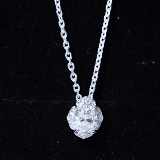 Oval-shaped lab-grown diamond vintage flower pendant necklace by Rosec Jewels featuring 6x8 mm diamonds in a delicate floral design.