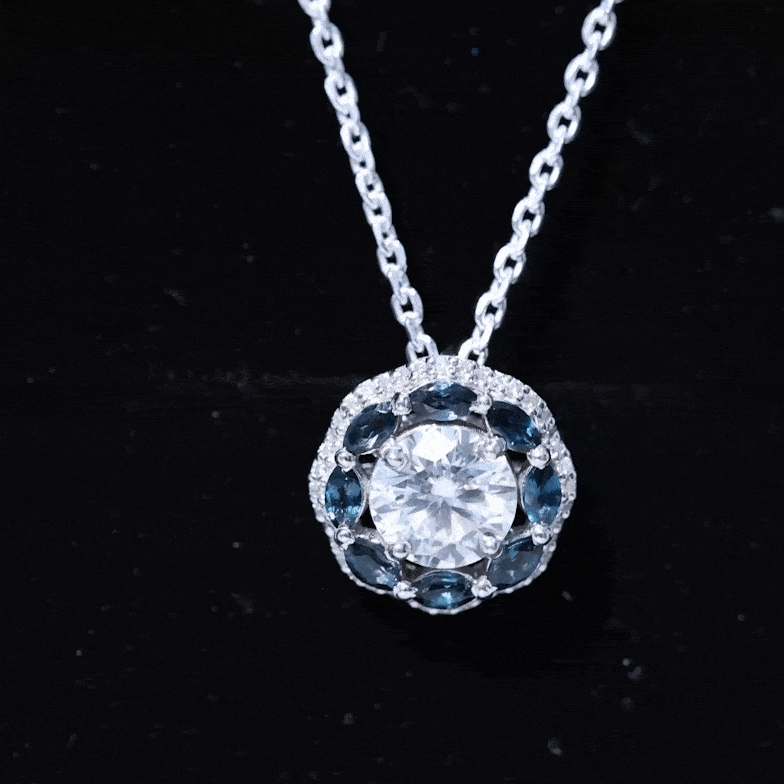 Yellow gold pendant with 2 carat lab-grown diamond halo and vibrant London Blue Topaz, showcasing elegant jewelry design.