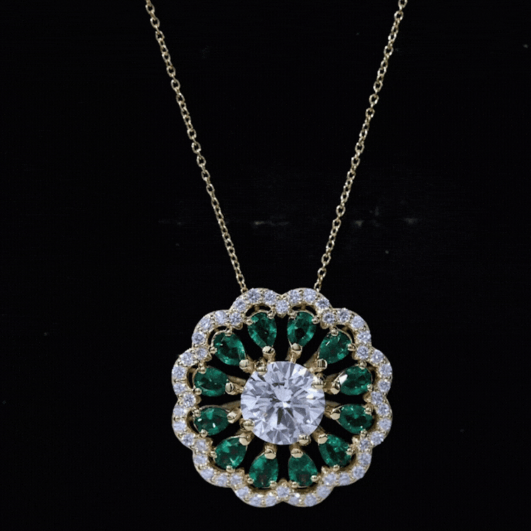 Yellow gold flower bridal pendant with 3-carat lab-grown diamond and emerald accents by Rosec Jewels.