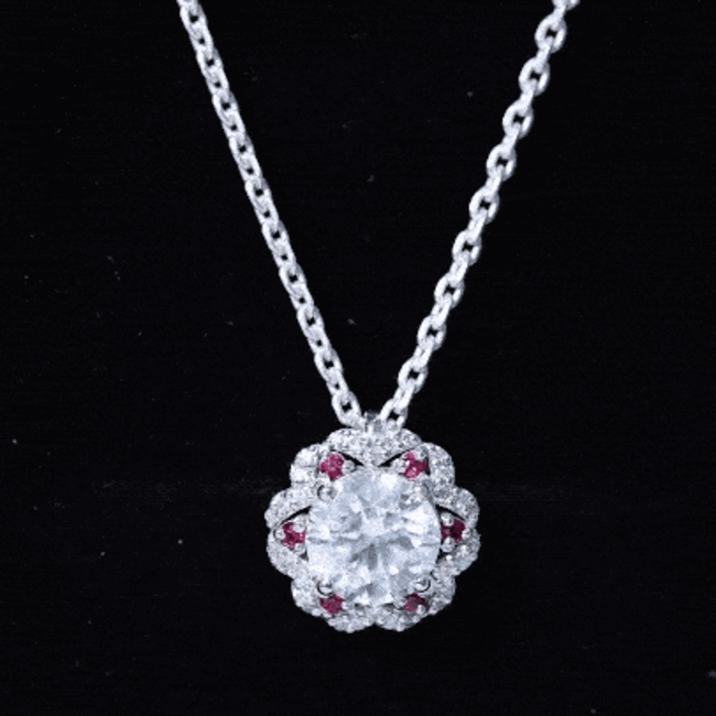 Yellow gold pendant necklace featuring a 2-carat lab-grown diamond flower with ruby accents by Rosec Jewels