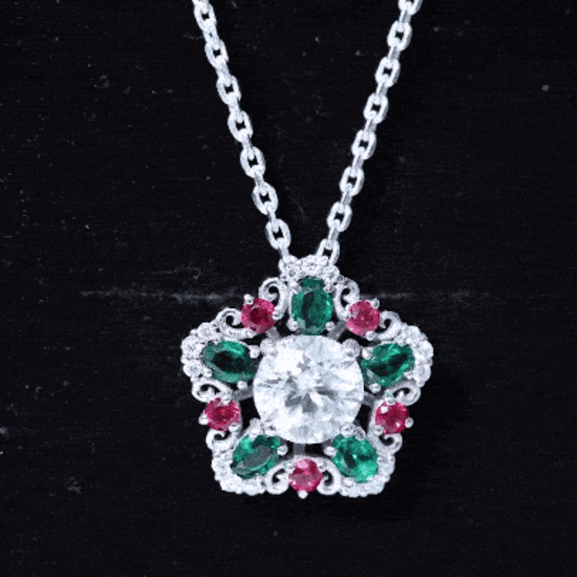 Yellow gold pendant necklace featuring lab-grown diamond, emerald, and ruby accents from Rosec Jewels.