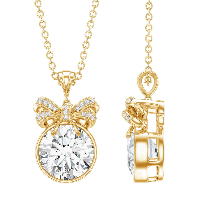 Bezel set lab-grown diamond solitaire pendant necklace with a cute bow design by Rosec Jewels.