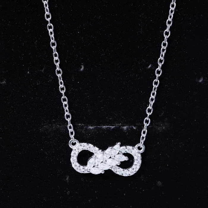 Yellow gold lab grown diamond infinity love knot pendant for women by Rosec Jewels, featuring sparkling diamonds and intricate design.