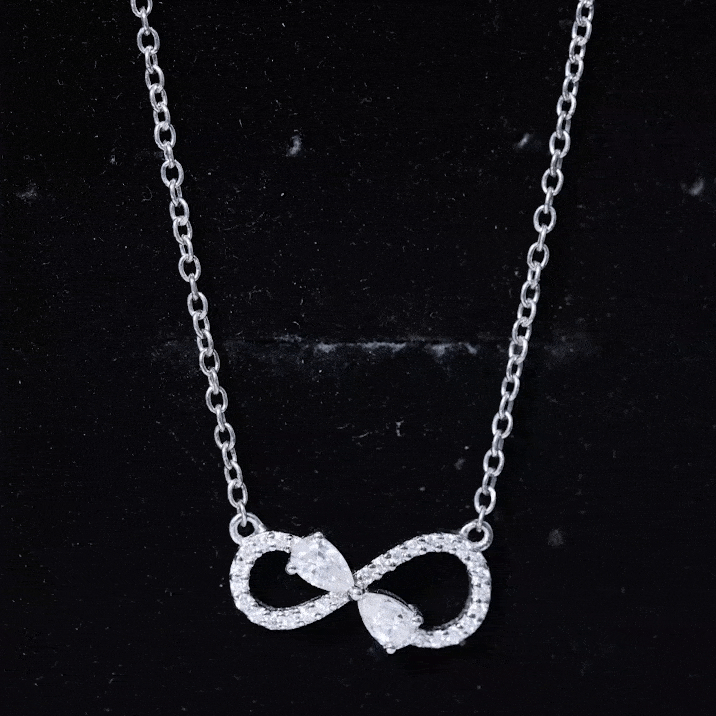 Yellow lab-grown diamond teardrop pendant necklace with a forever knot design from Rosec Jewels.