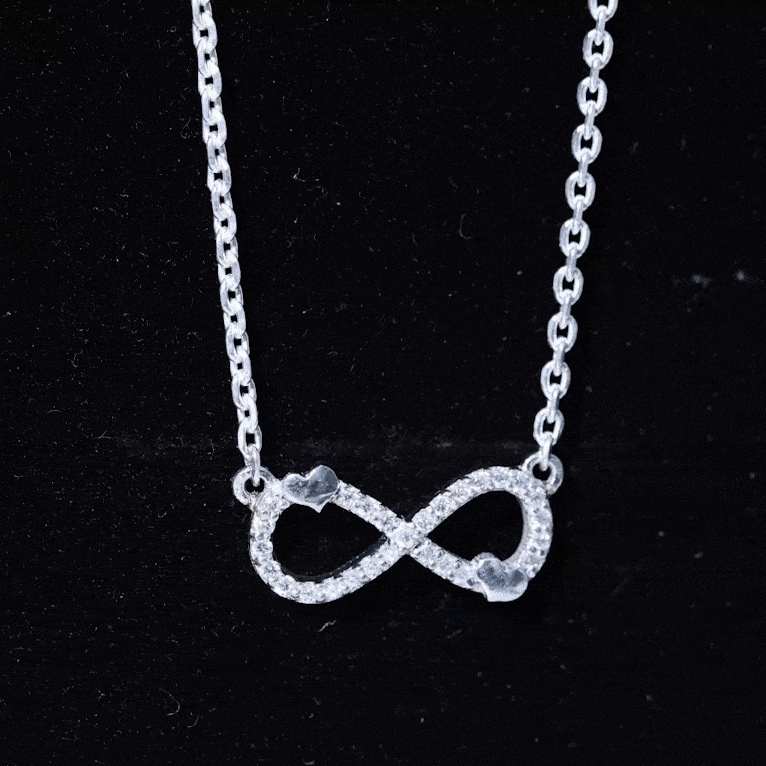 Lab grown diamond infinity knot pendant with a cute heart, yellow gold, elegant jewelry piece from Rosec Jewels.