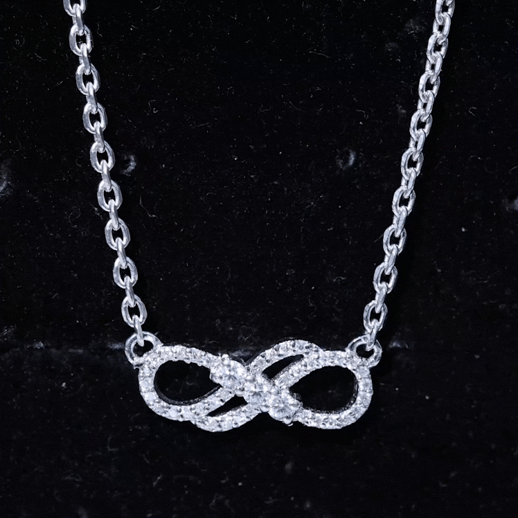 Yellow gold lab grown diamond double infinity symbol pendant from Rosec Jewels, featuring sparkling diamonds and delicate design.