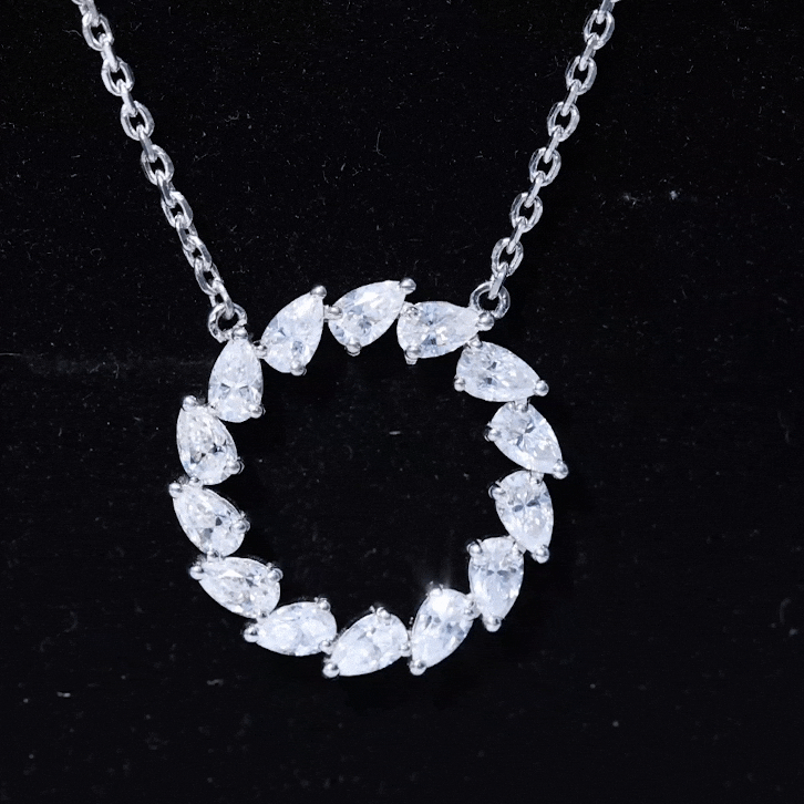 Yellow gold eternity circle necklace with pear-shaped diamonds by Rosec Jewels, showcasing a luxurious pendant design