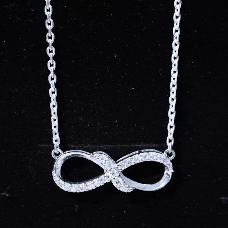 Yellow lab grown diamond infinity knot pendant necklace by Rosec Jewels featuring sparkling accent stones.