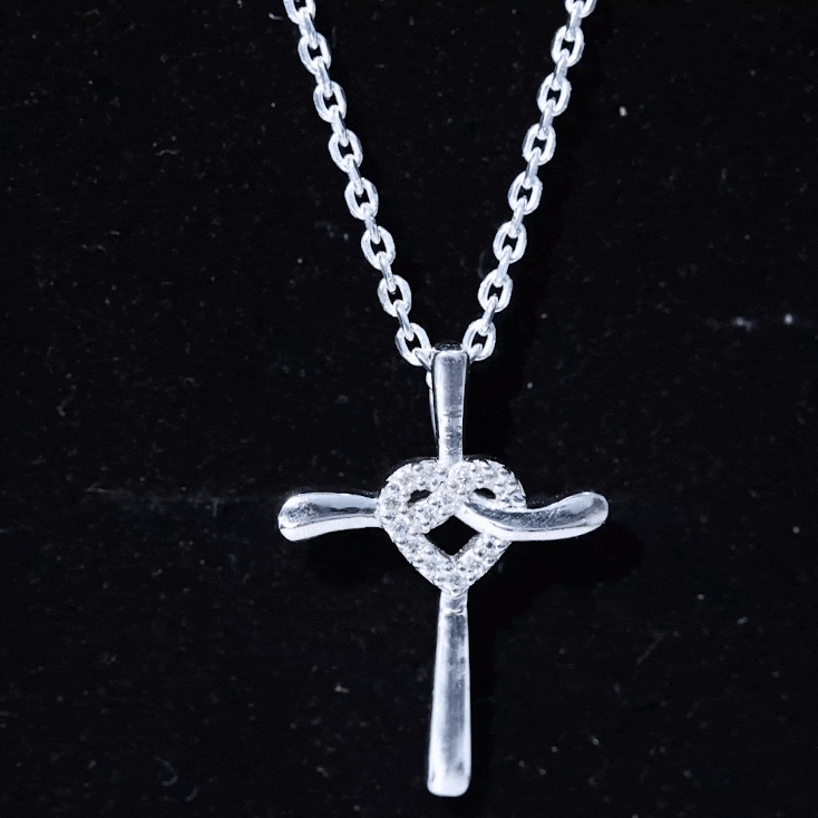 Yellow gold Catholic cross pendant with a heart-shaped lab-grown diamond, rosec Jewels pendant necklace with religious symbolism.