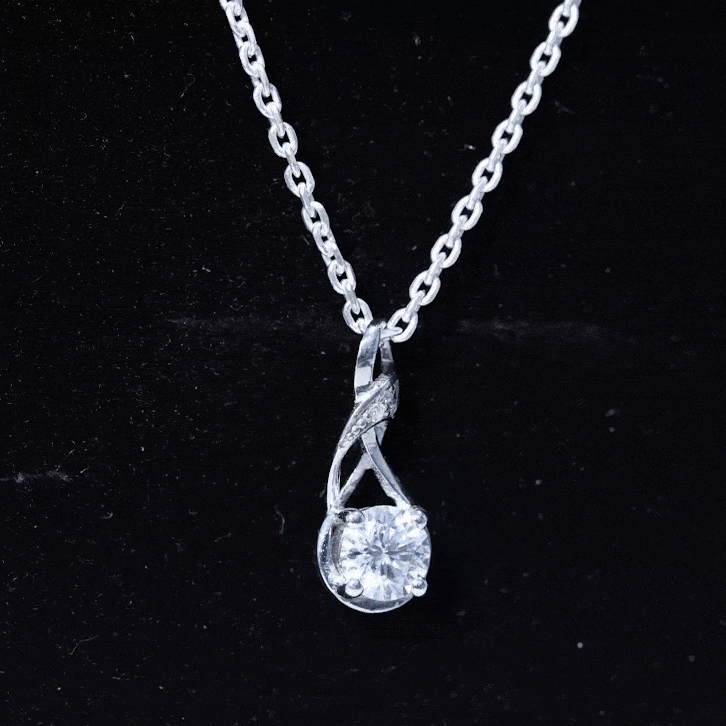 Yellow gold infinity pendant necklace with a 6mm round diamond from Rosec Jewels, elegant jewelry for special occasions.